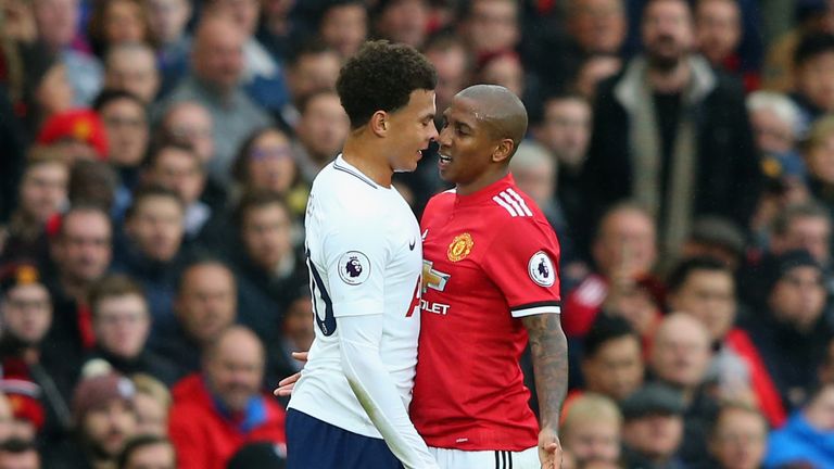 Dele Alli and Ashley Young confront each other during the Premier League match at Old Trafford