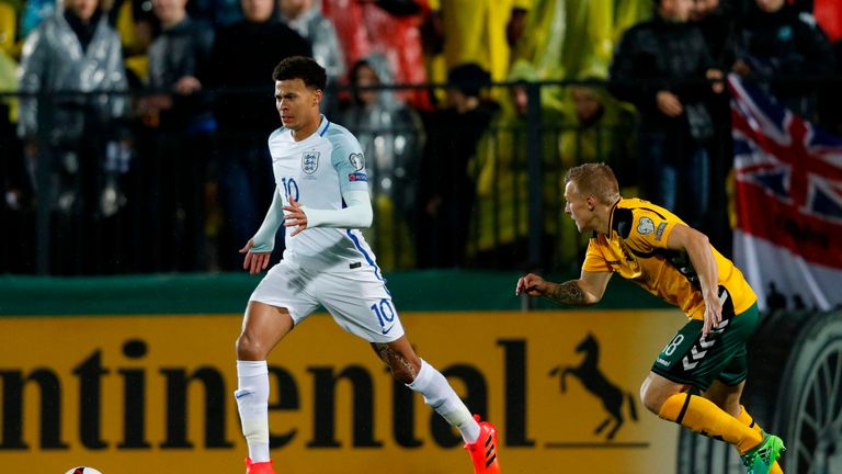 Dele Alli takes on Lithuania's midfielder Ovidijus Verbickas in the first half