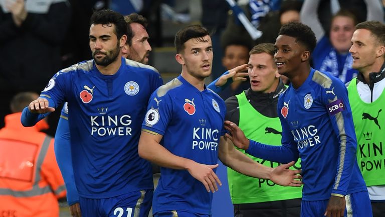 Leicester City's Demarai Gray (R) celebrates the team's second goal with team-mates during the Premier League football match v Everton