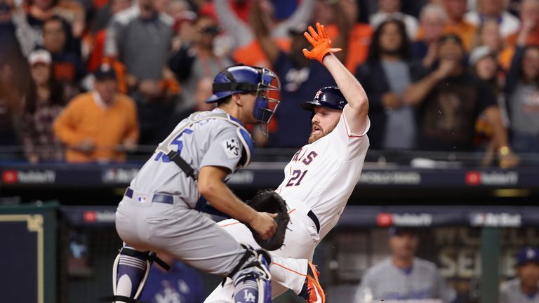 HOUSTON, TX - OCTOBER 30:  Derek Fisher #21 of the Houston Astros slides in to home plate scoring the game winning run during the tenth inning against Aust