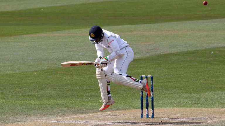 Dinesh Chandimal of Sri Lanka takes evasive action to a bouncer during day four of the First Test match between New Zealand