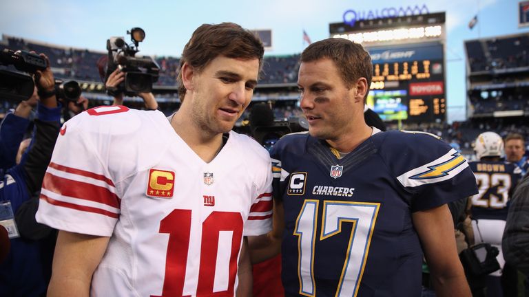 SAN DIEGO, CA - DECEMBER 08:  Eli Manning #10 of the New York Giants and Philip Rivers #17 of the San Diego Chargers come together at the conclusion of the