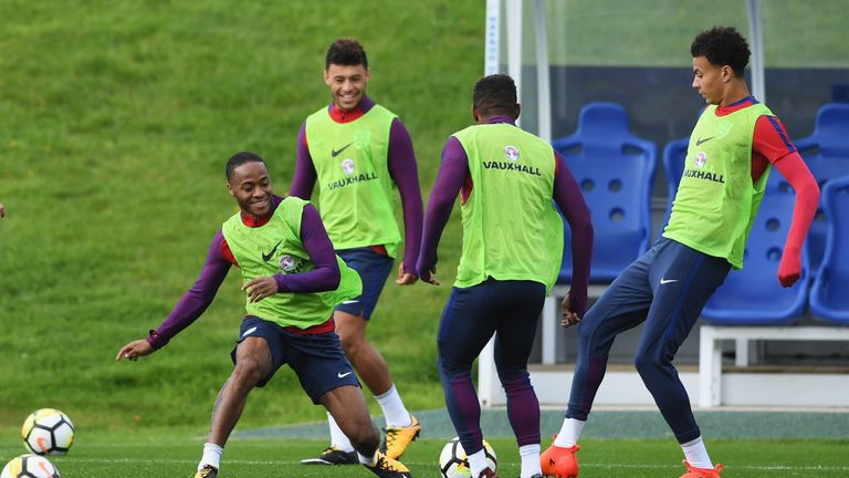 BURTON-UPON-TRENT, ENGLAND - OCTOBER 02:  Raheem Sterling, Alex Oxlade-Chamberlain, Jermain Defoe and Dele Alli of England in action during an England trai