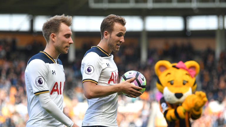 HULL, ENGLAND - MAY 21: Harry Kane of Tottenham Hotspur walks off the pitch alongside Christian Eriksen after scoring a hat-trick and winning the Premier L