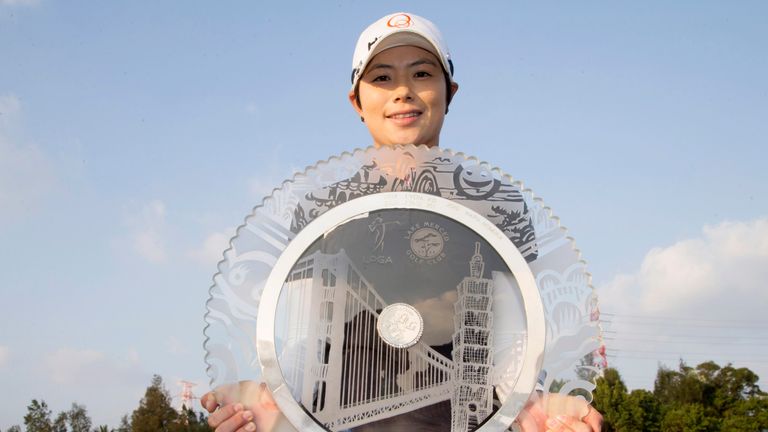 TAIPEI, TAIWAN - OCTOBER 22: Eun-Hee Ji of South Korea poses while holding the trophy on the 18th green after winning the Swinging Skirts LPGA Taiwan Champ