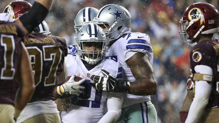 LANDOVER, MD - OCTOBER 29: Running back Ezekiel Elliott #21 of the Dallas Cowboys scores a touchdown against the Washington Redskins during the second quar