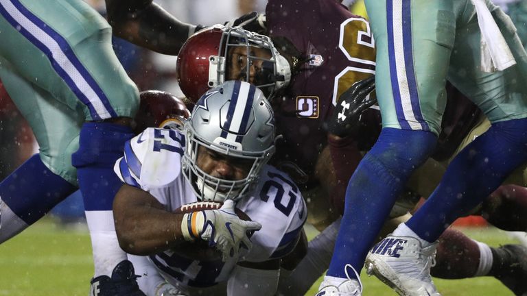 LANDOVER, MD - OCTOBER 29: Running back Ezekiel Elliott #21 of the Dallas Cowboys scores a touchdown against the Washington Redskins during the second quar