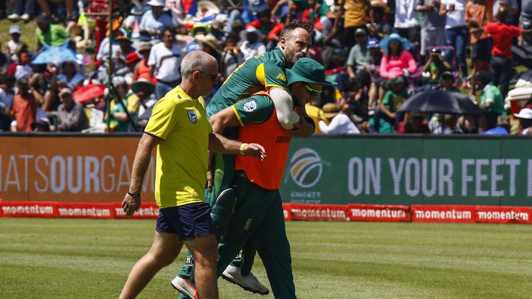 South Africa's captain Faf du Plessis leaves the field after being injury during their ODI one-day international match at the Buffalo Park Cricket Grounds 