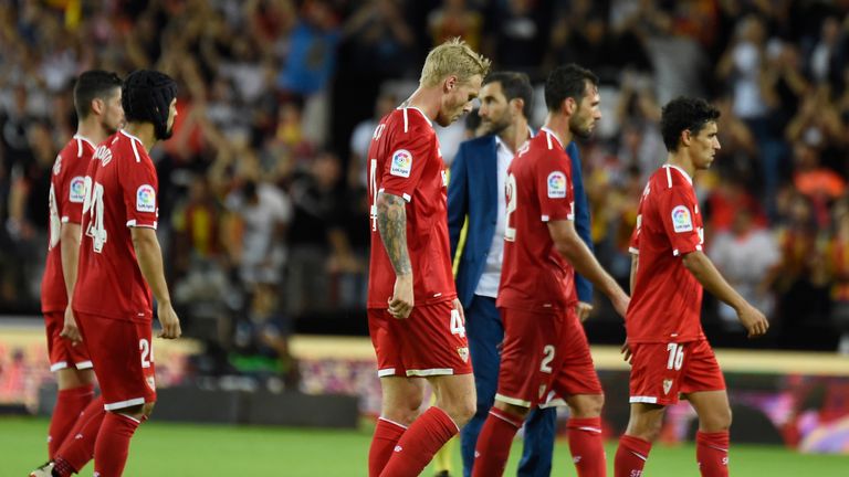 Sevilla's players react at the end of the Spanish league football match Valencia CF vs Sevilla FC at the Mestalla stadium in Valencia on October 21, 2017. 