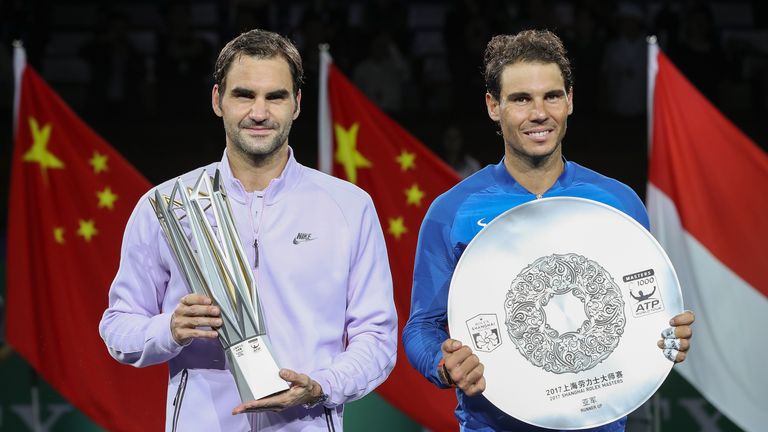 SHANGHAI, CHINA - OCTOBER 15:  Roger Federer of Switzerland with Rafael Nadal of Spain pose with their trophy after the Men's singles final mach on day eig