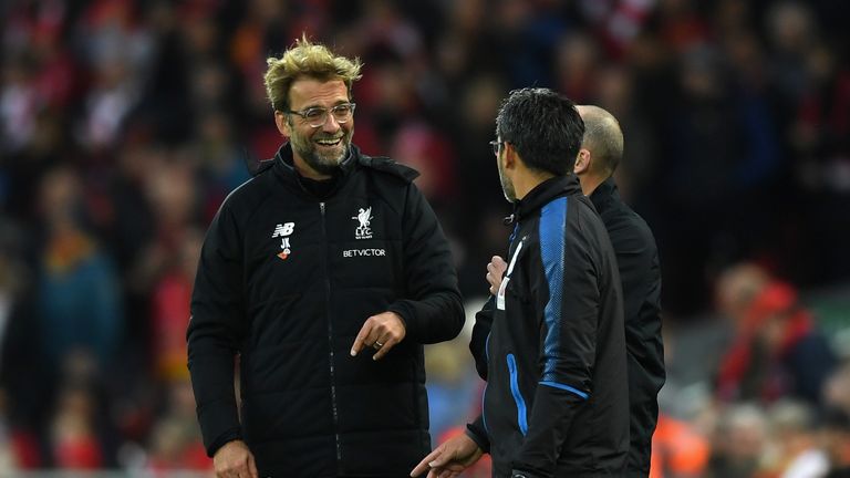 LIVERPOOL, UNITED KINGDOM - OCTOBER 28:  Jurgen Klopp, Manager of Liverpool and David Wagner, Manager of Huddersfield Town share a joke during the Premier 
