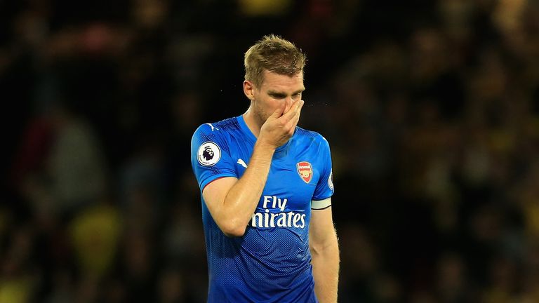 WATFORD, ENGLAND - OCTOBER 14:  Per Mertesacker of Arsenal looks dejected in defence the Premier League match between Watford and Arsenal at Vicarage Road 