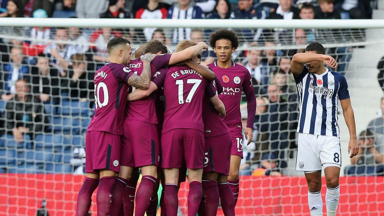 Fernandinho of Manchester City celebrates scoring his side's second goal with his team-mates during the Premier League match at West Brom