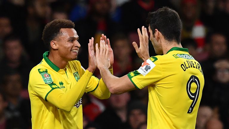 Norwich City's English midfielder Josh Murphy (L) celebrates scoring the opening goal during the English League Cup fourth round football match between Ars