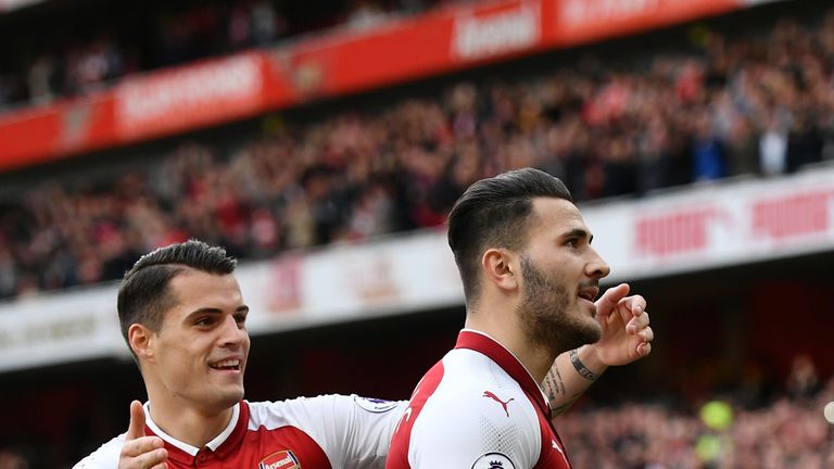 Sead Kolasinac of Arsenal celebrates scoring his side's first goal with Granit Xhaka during the Premier League match v Swansea City