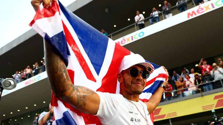 Lewis Hamilton of celebrates after winning his fourth F1 World Drivers Championship at the conclusion of the 2017 Mexican Grand Prix