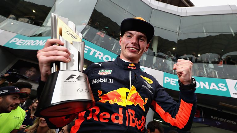 Race winner Max Verstappen celebrates with his Red Bull team after the Malaysian Formula One grand prix