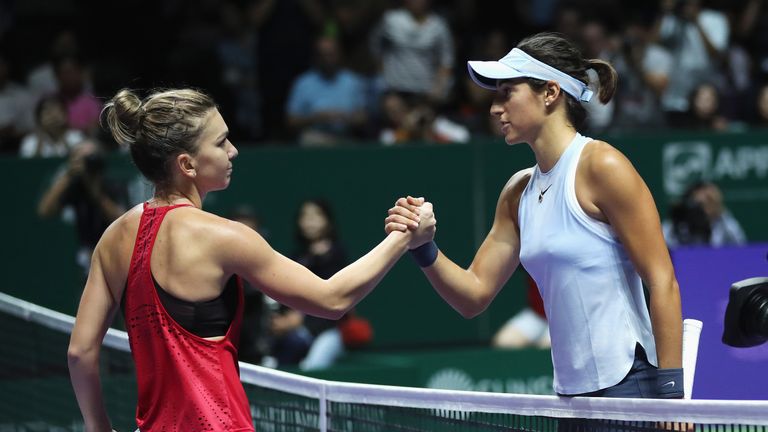 SINGAPORE - OCTOBER 23:  Simona Halep of Romania shakes hands with Caroline Garcia of France after her victory in their singles match during day 2 of the B