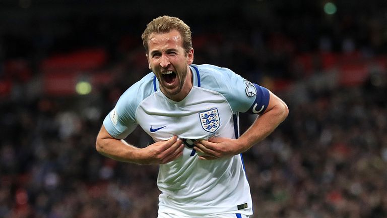 Harry Kane celebrates after scoring England's late winner against Slovenia