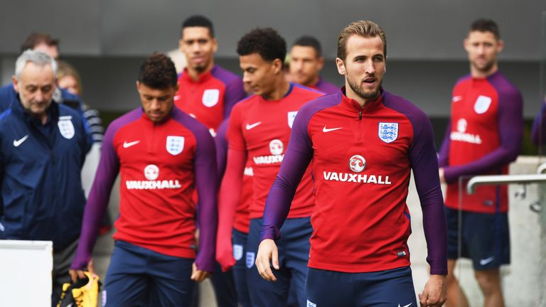 Harry Kane leads his England team-mates out onto the pitch during a training session at St George's park