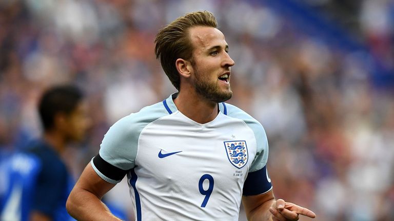 England's forward Harry Kane celebrates after scoring during the international friendly football match between France and England