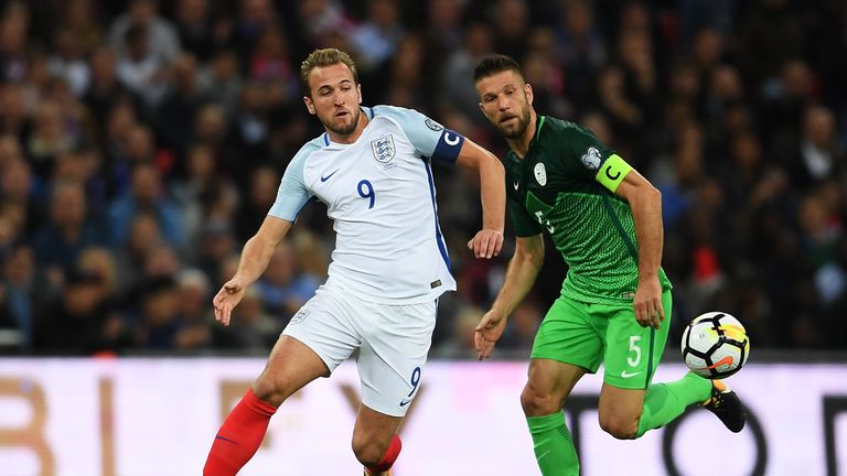 Harry Kane of England evades Bostjan Cesar of Slovenia during the FIFA 2018 World Cup  Group F Qualifier between England and Slovenia