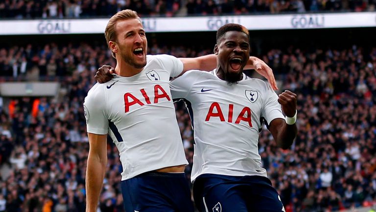Harry Kane (L) celebrates with Tottenham Hotspur's Serge Aurier (R) 
