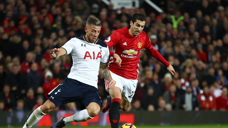 Toby Alderweireld and Henrikh Mkhitaryan compete for the ball during the Premier League match at Old Trafford on December 11, 2016