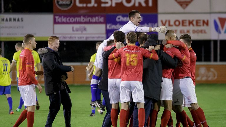 HSV Hoek's players celebrate between penalties during a football match in Lisse, on October 11, 2017, after the Royal Dutch Football Association (KNVB) ord
