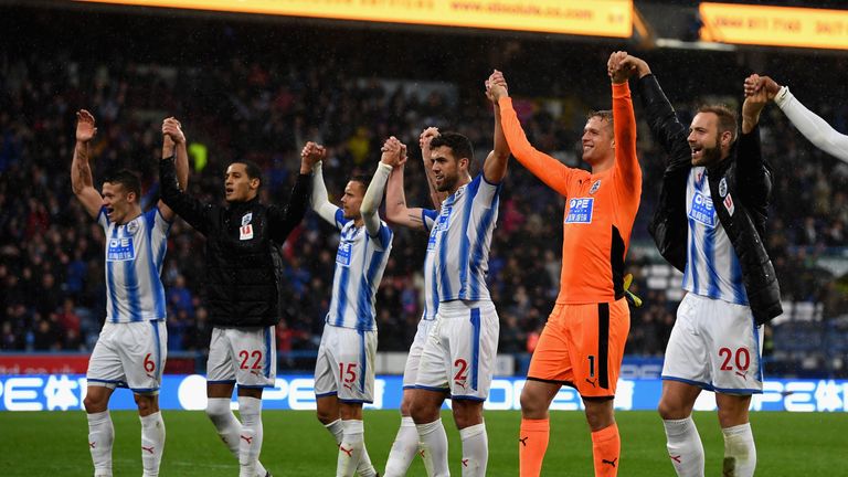 HUDDERSFIELD, ENGLAND - OCTOBER 21:  Huddersfield Town players celebrate after winning the Premier League match against Manchester United,