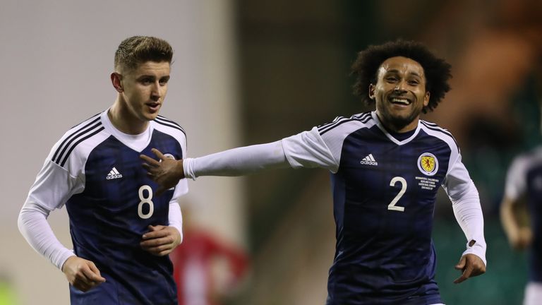 EDINBURGH, SCOTLAND - MARCH 22:  Tom Cairney and Ikechi Anya of Scotland celebrates scotlands' only goal during the International Challenge Match between S