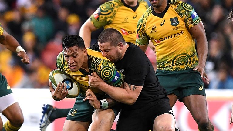 Israel Folau is tackled by Dane Coles