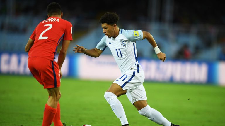 England's Jadon Sancho (R) and Chile's Gaston Zuniga fight for the ball during the group stage football match between England and Chile in the FIFA U-17 Wo