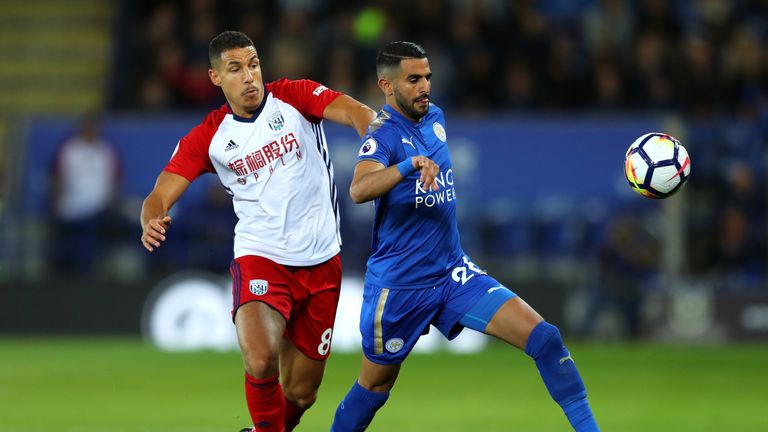 Riyad Mahrez of Leicester City and Jake Livermore of West Bromwich Albion during the Premier League match