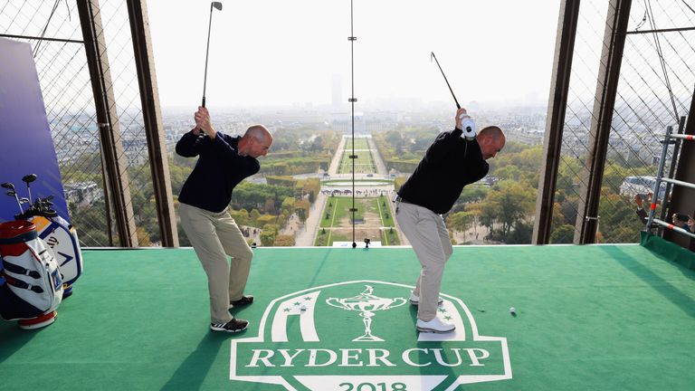 PARIS, FRANCE - OCTOBER 17:  Jim Furyk, Captain of The United States and Thomas Bjorn, Captain of Europe tee off from a platform on the Eiffel Tower during