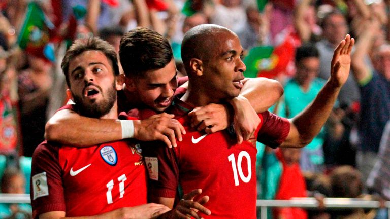 Joao Mario celebrates Portugal's opening goal with Andre Silva (C) and Bernardo Silva