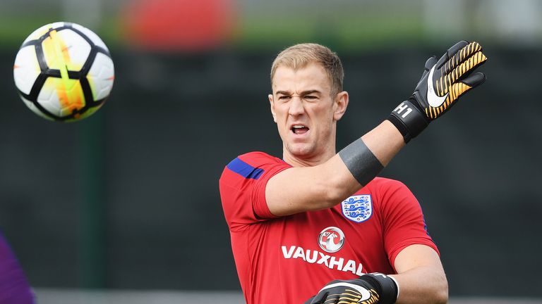 Joe Hart throws the ball during an England training session at St George's Park