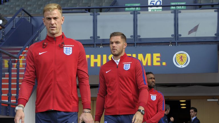 England's goalkeeper Joe Hart (L) and England's goalkeeper Jack Butland walk out to experience the stadium during a squad walkaround session at Hampden Par