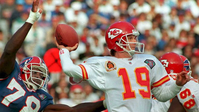 FILES, UNITED STATES:  This 30 October 94 file photo shows Kansas City Chiefs quarterback Joe Montana (19) preparing to pass against the rush of Buffalo Bi