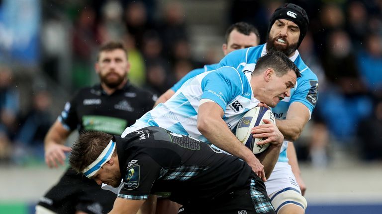 Leinster's Johnny Sexton tackled by George Turner of Glasgow.