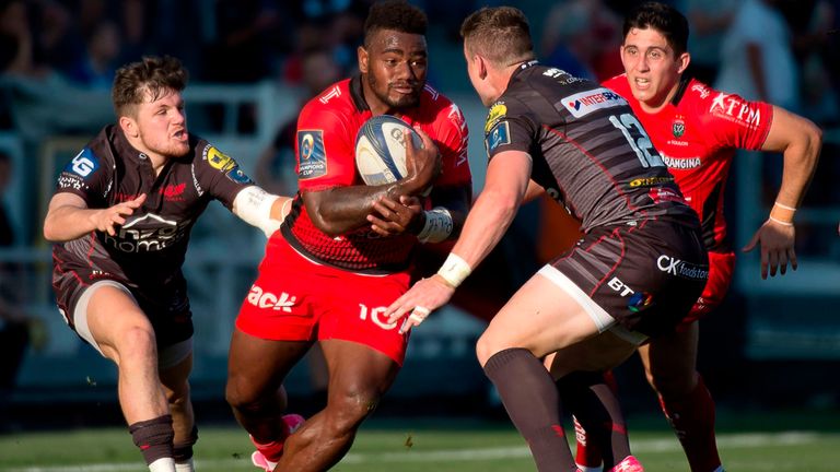 RC Toulon's Fijian winger Josua Tuisova (2ndL) vies with Llanelli's Welsh centre Scott Williams (2ndR) during the European Champions Cup rugby union match 