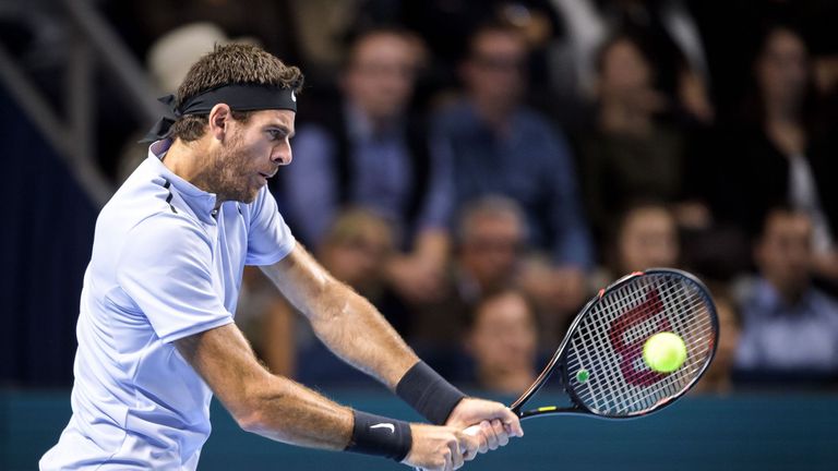 Argentina's Juan Martin Del Potro returns a ball to Switzerland's Roger Federer during their final tennis match at the Swiss Indoors ATP 500 tennis tournam