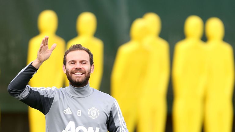 Juan Mata appears in good spirits during a first team training session at Manchester United's Aon Training Complex