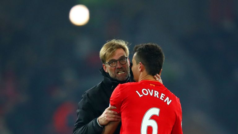 LIVERPOOL, ENGLAND - NOVEMBER 26: Jurgen Klopp, Manager of Liverpool celebrates Dejan Lovren after their 2-0 win in the Premier League match