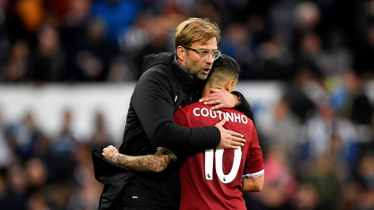Jurgen Klopp and Philippe Coutinho embrace after the final whistle at St James Park