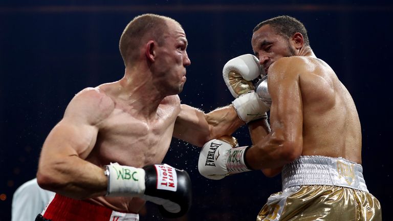 Juergen Braehmer (L) of Germany exchange punches with Rob Brant of the United States during the Ali Trophy Super Middleweight Quarter-Final fight