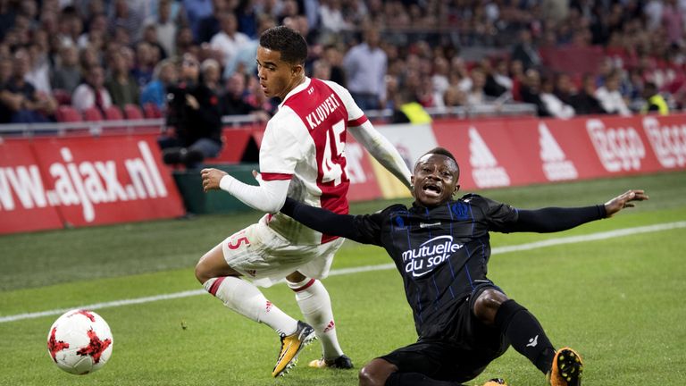 Ajax's forward Justin Kluivert (L) fights for the ball with OGC Nice's midfielder Jean Seri during the Champions League second leg football match between O