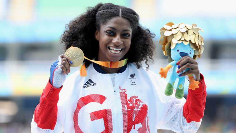 Gold medalist Kadeena Cox of Great Britain celebrates on the podium at the medal ceremony for the Women's 400m - T3