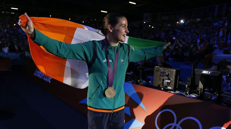 Katie Taylor of Ireland waves her national colors as she celebrates her gold medal victory in the women's boxing Lightweight final in 2012