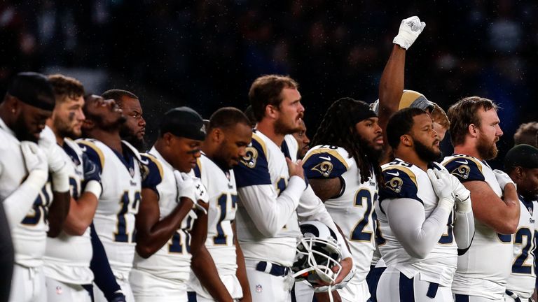 LONDON, ENGLAND - OCTOBER 22: A raised white gloved clenched fist by a Rams player during the US national anthem during the NFL match between the Arizona C